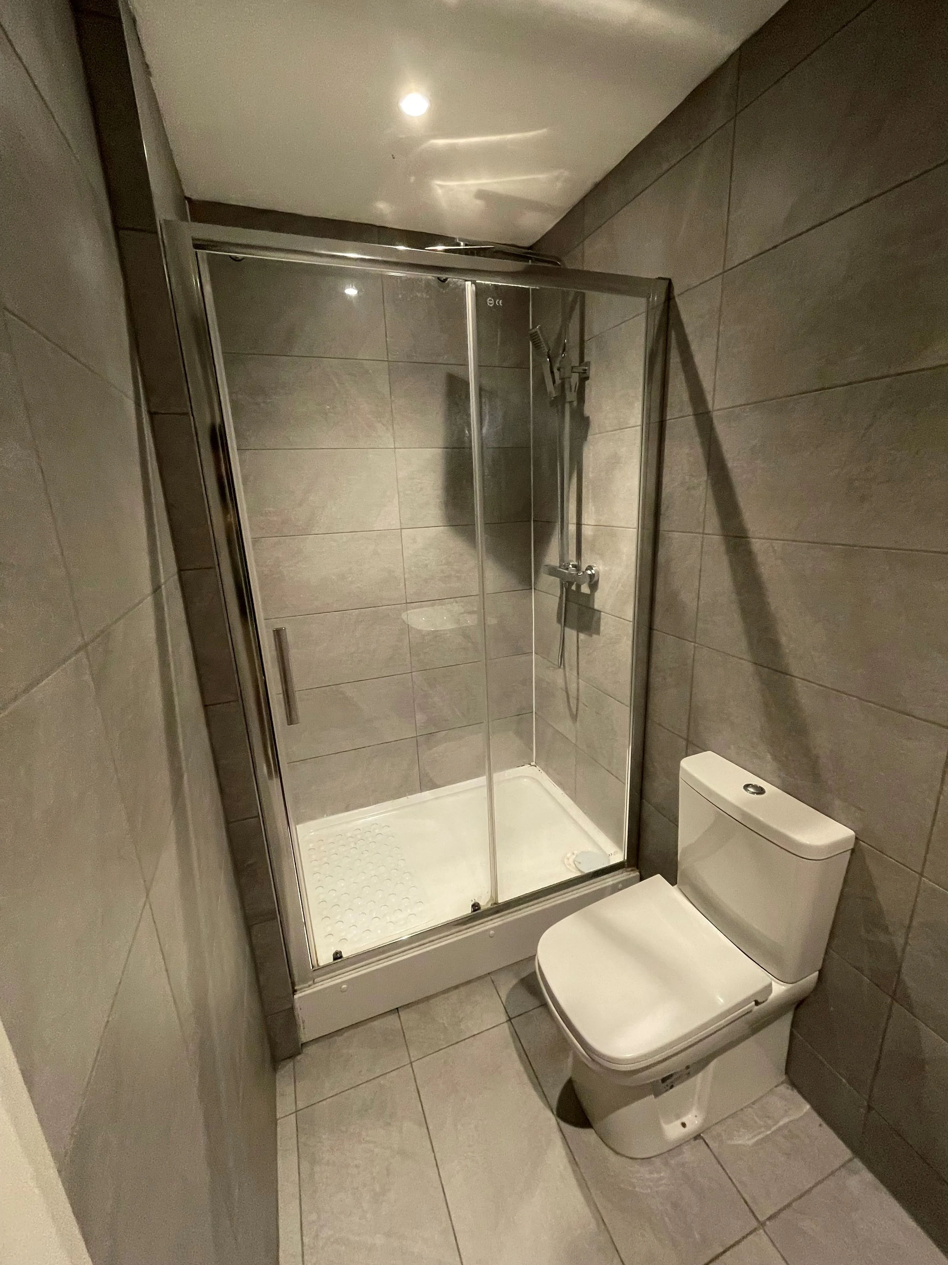 MIXED USE INVESTMENT OPPORTUNITY: A FREEHOLD PROPERTY COMPRISING TWO COMMERCIAL SHOPS WITH FIVE FLATS ABOVE AND CAR PARK TO THE REAR