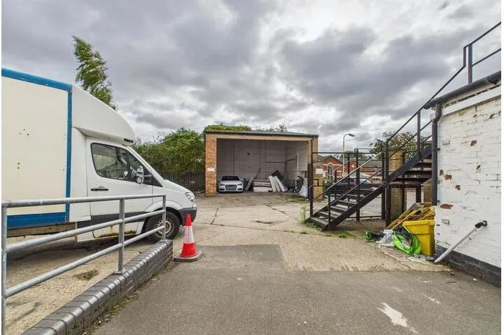 MIXED USE INVESTMENT OPPORTUNITY: A FREEHOLD PROPERTY COMPRISING TWO COMMERCIAL SHOPS WITH FIVE FLATS ABOVE AND CAR PARK TO THE REAR