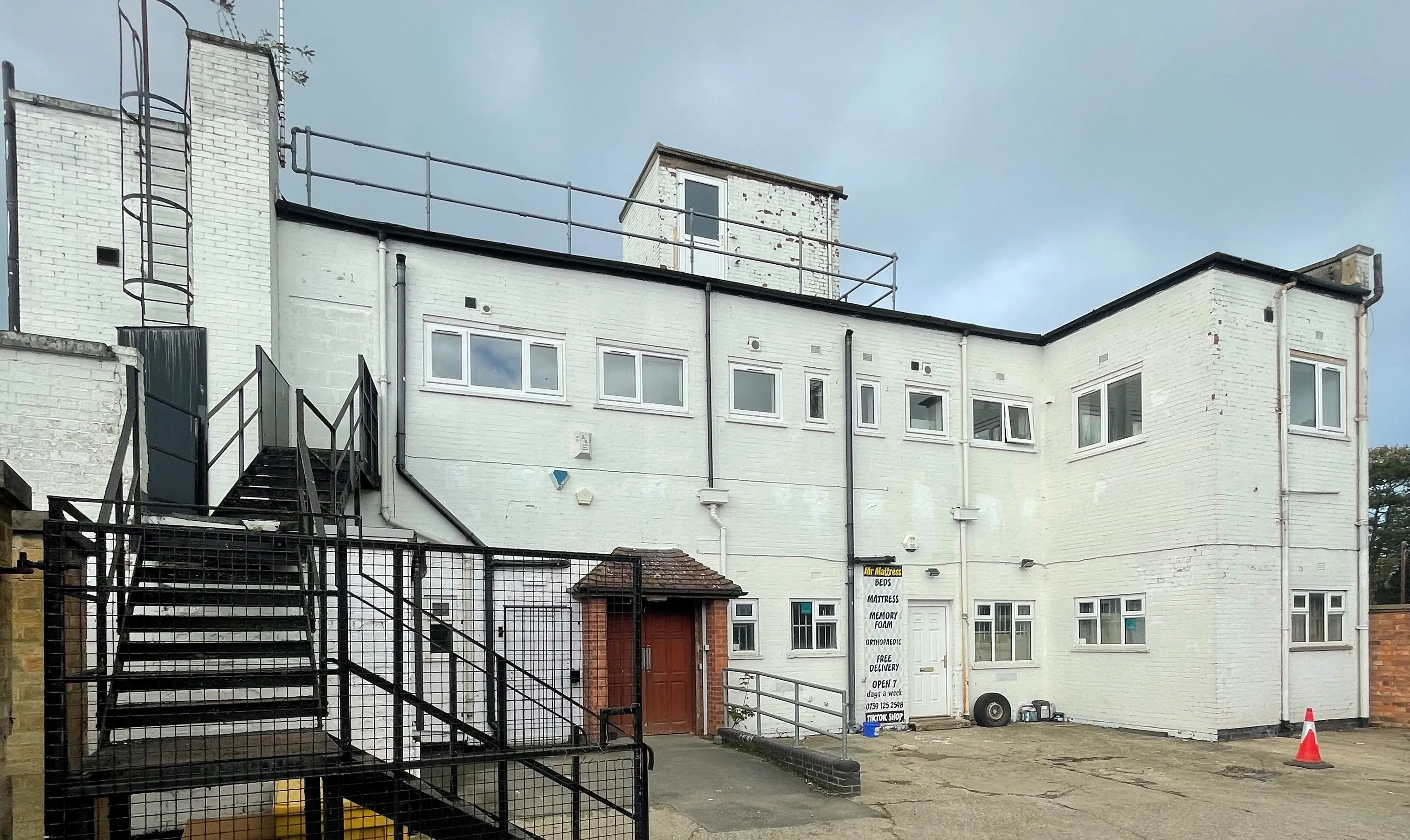 MIXED USE INVESTMENT OPPORTUNITY: A FREEHOLD PROPERTY COMPRISING TWO COMMERCIAL SHOPS WITH FIVE FLATS ABOVE AND CAR PARK TO THE REAR