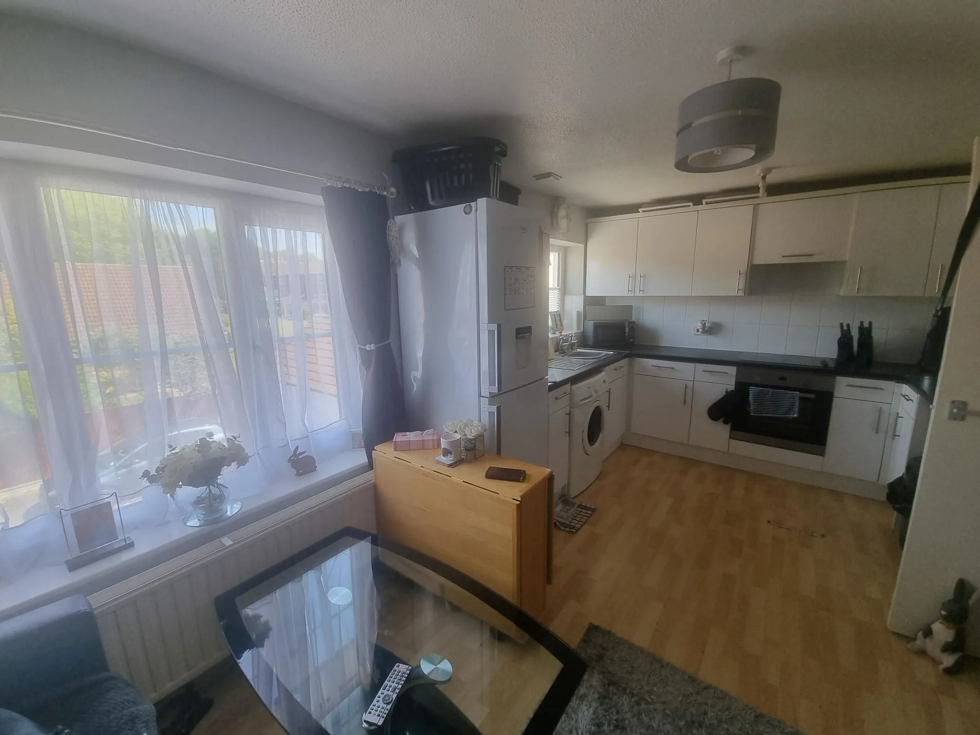 BUY TO LET INVESTMENT: FIRST FLOOR LEASEHOLD FLAT CLOSE TO LAINDON RAILWAY STATION WITH A TENANT IN OCCUPATION PRODUCING AN INCOME OF £10,200 PA