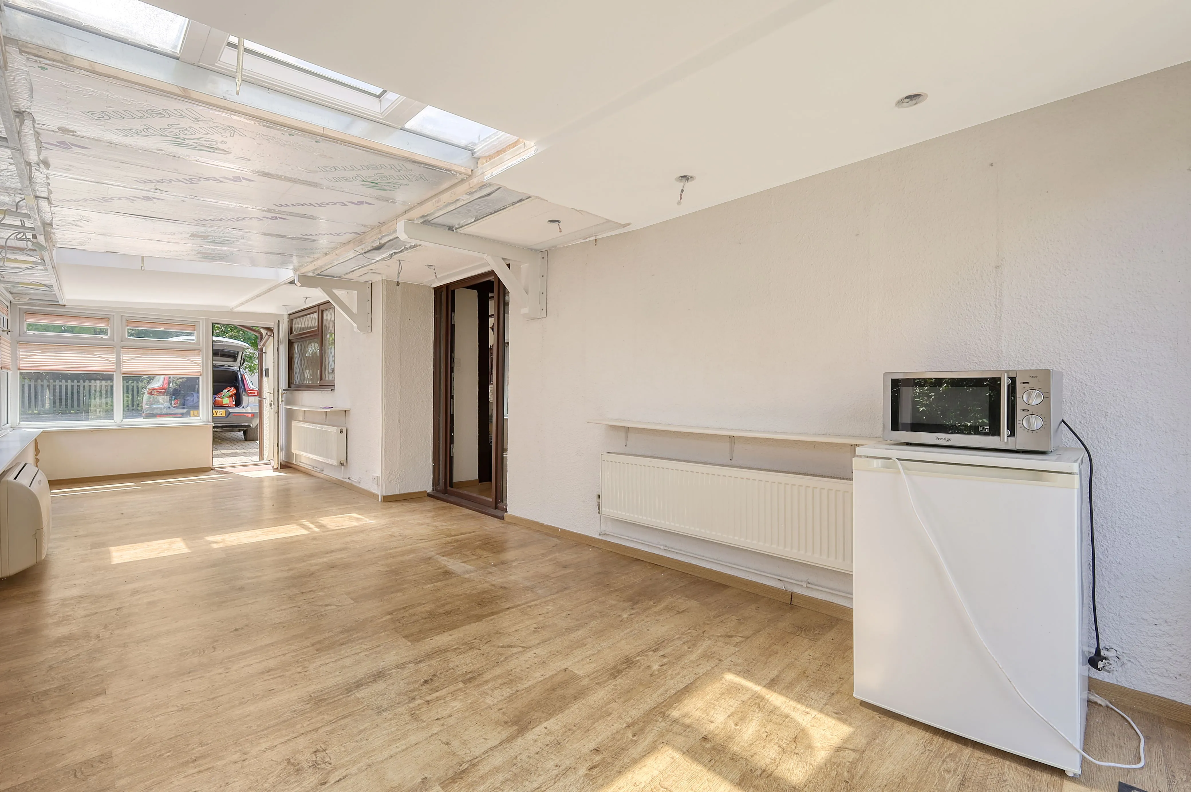 REFURBISHMENT OPPORTUNITY: A VACANT FREEHOLD DETACHED TIMBER FRAMED BUNGALOW IN A POPULAR VILLAGE IN NEED OF MODERNISATION AND IMPROVEMENT 