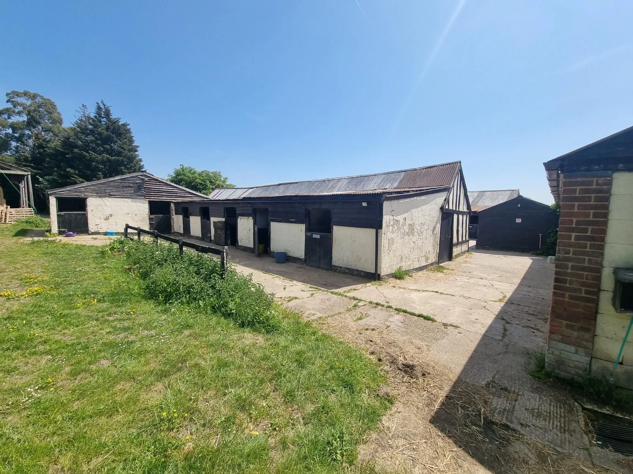FARM INVESTMENT: A FREEHOLD FARM SITUATED ON OVER 60 ACRES OF GRAZING LAND WITH TWO DETACHED FARM HOUSES AND A NUMBER OF OUTBUILDINGS