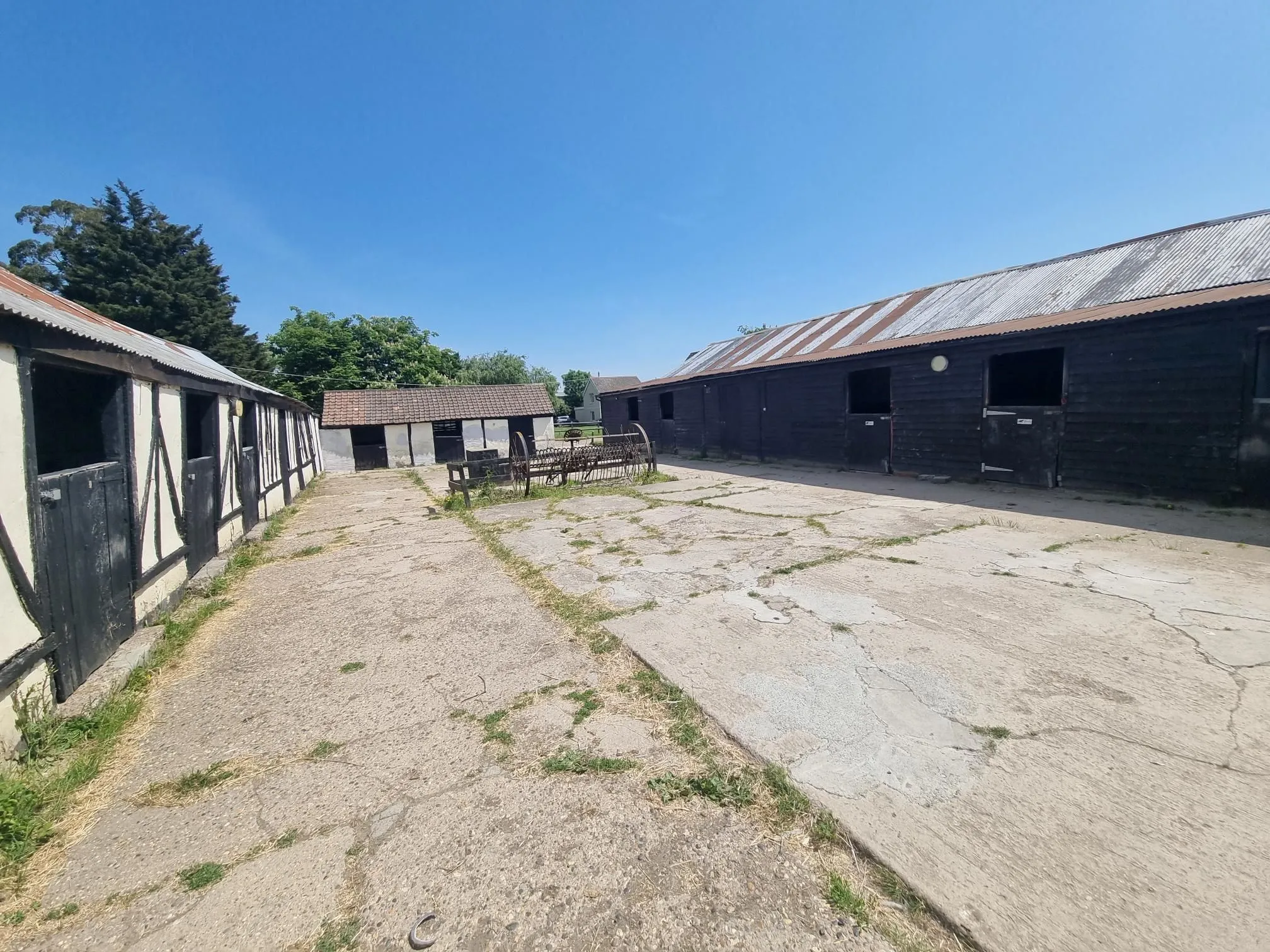 FARM INVESTMENT: A FREEHOLD FARM SITUATED ON OVER 60 ACRES OF GRAZING LAND WITH TWO DETACHED FARM HOUSES AND A NUMBER OF OUTBUILDINGS