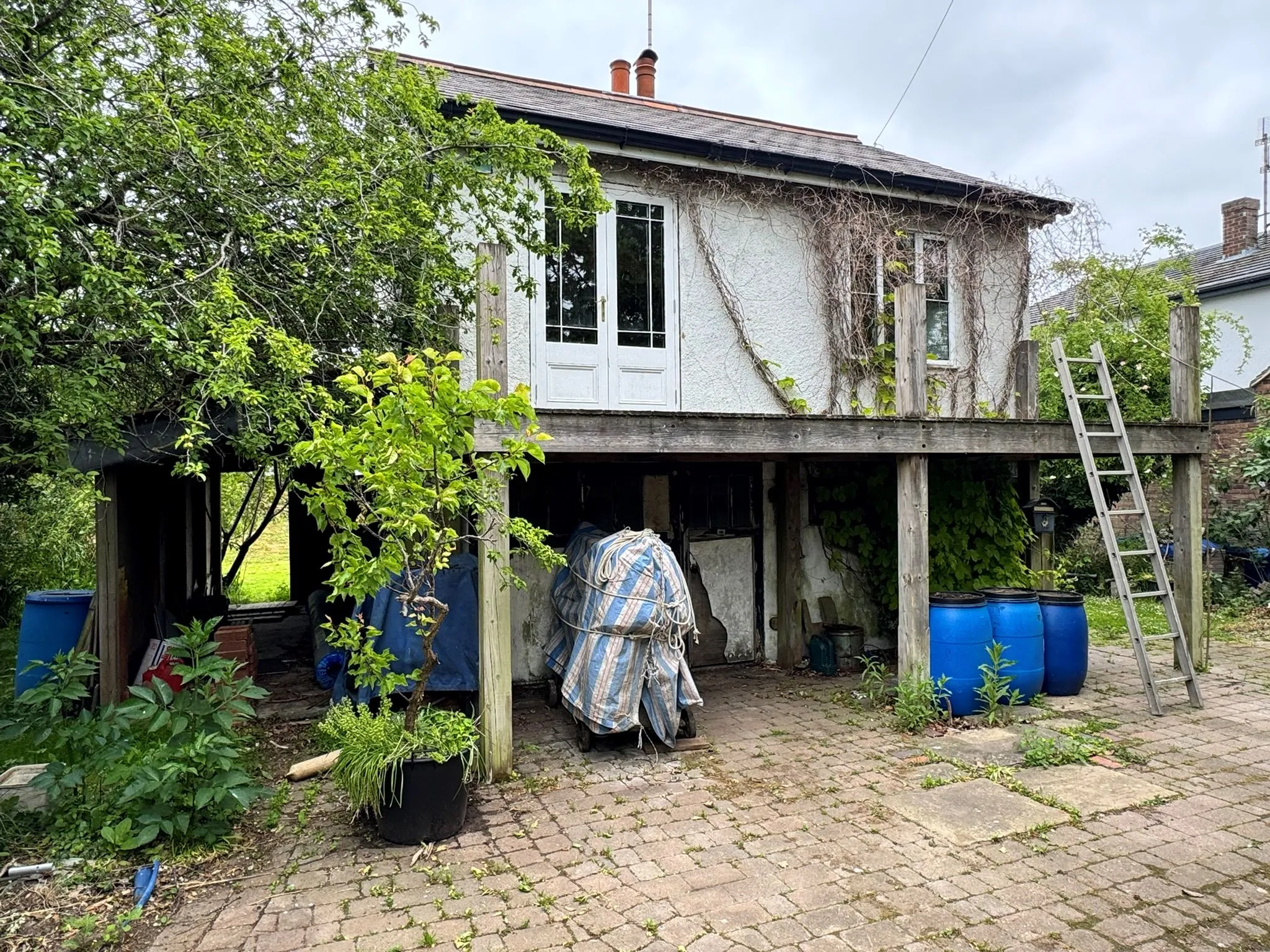 DEVELOPMENT POTENTIAL: VACANT FREEHOLD DETACHED CHALET ON 1/4 ACRE PLOT WITH RIVER FRONTED POSITION AND PRIVATE FIXED JETTY