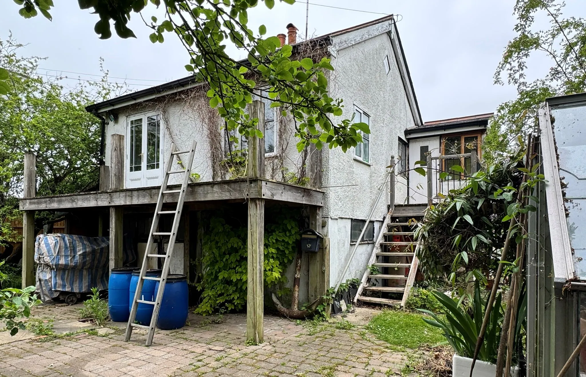 DEVELOPMENT POTENTIAL: VACANT FREEHOLD DETACHED CHALET ON 1/4 ACRE PLOT WITH RIVER FRONTED POSITION AND PRIVATE FIXED JETTY