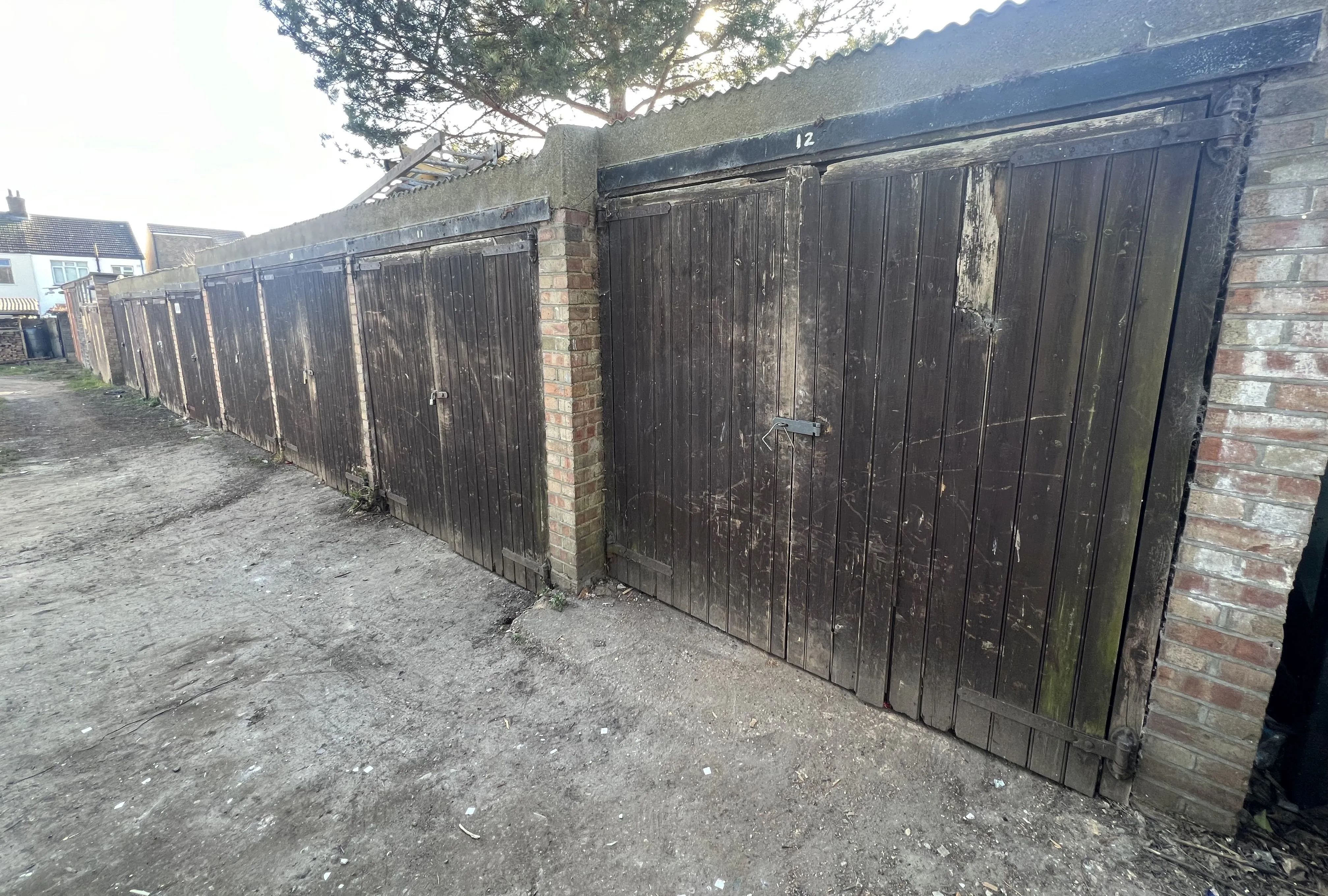 COMMERCIAL INVESTMENT: A FREEHOLD SITE INCLUDING 11 LOCK UP GARAGES CURRENTLY PART LET/PART VACANT WITH POTENTIAL TO INCREASE THE INCOME