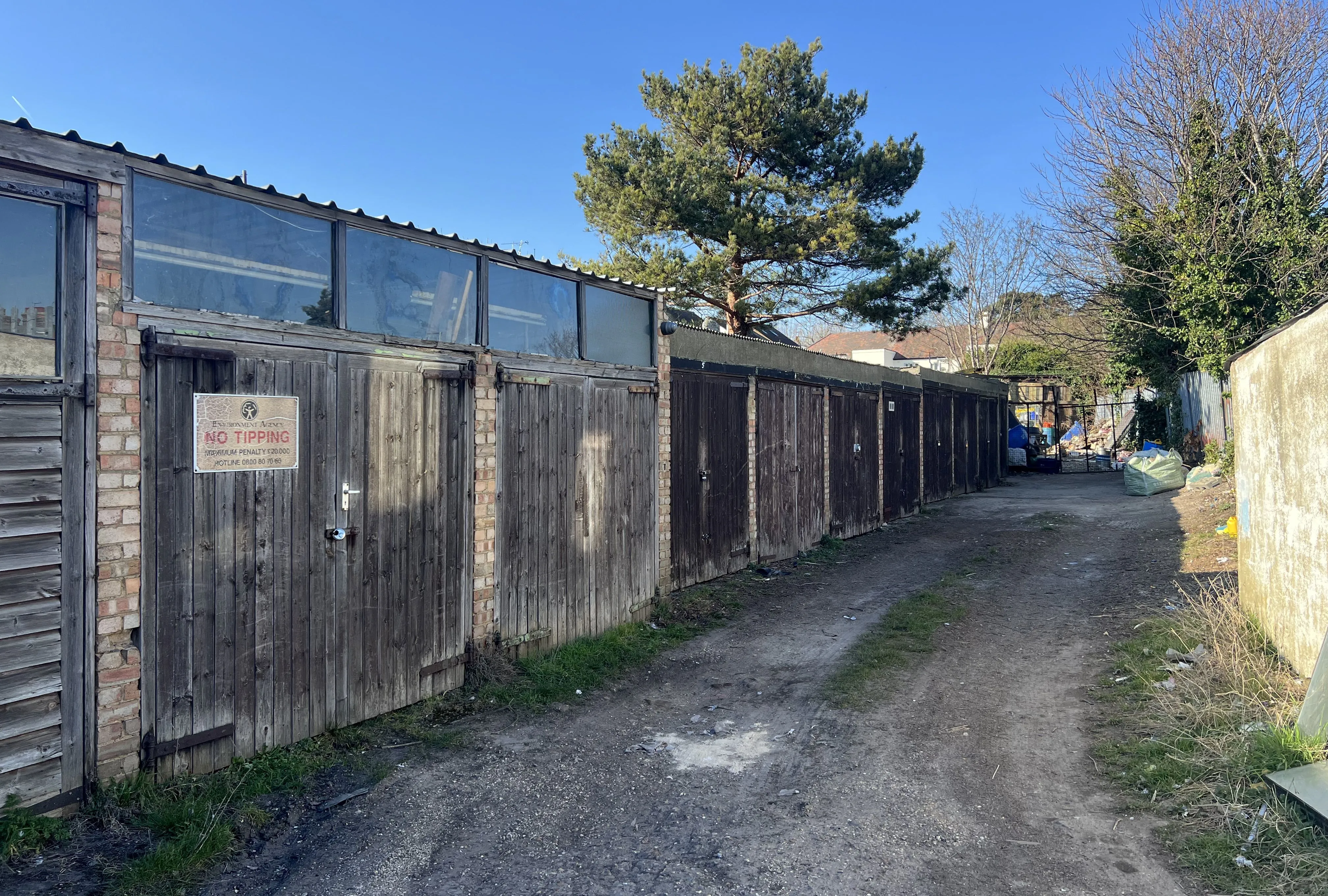 COMMERCIAL INVESTMENT: A FREEHOLD SITE INCLUDING 11 LOCK UP GARAGES CURRENTLY PART LET/PART VACANT WITH POTENTIAL TO INCREASE THE INCOME