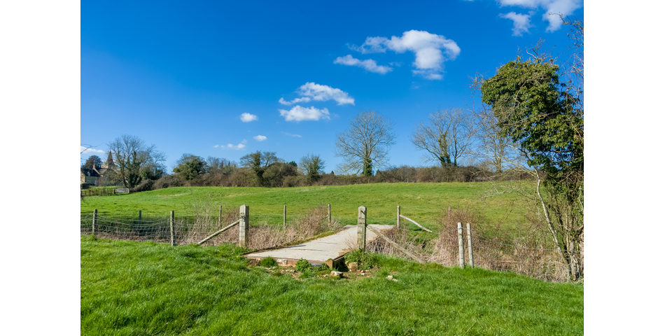 Approximately 6.57 acres of permanent pasture on the edge of this popular village.