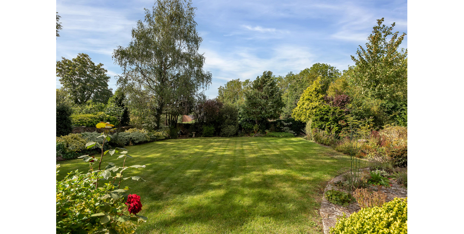 An extensive site to include farmhouse, outbuildings and gardens.