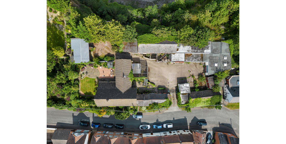 An extensive site to include farmhouse, outbuildings and gardens.