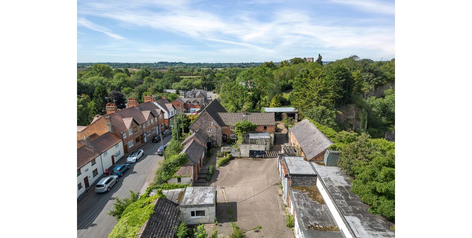 An extensive site to include farmhouse, outbuildings and gardens.