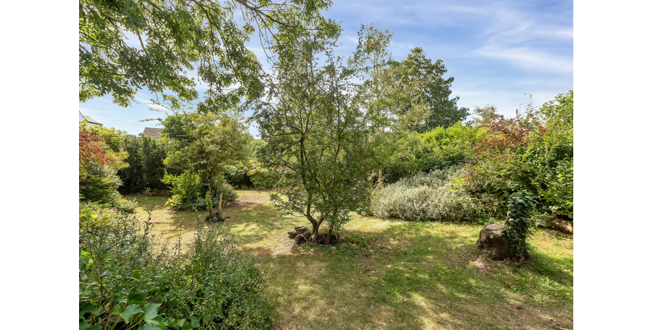 An extensive site to include farmhouse, outbuildings and gardens.