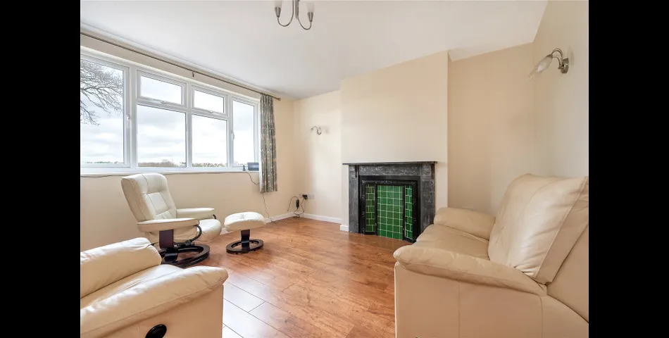 A two-bedroom semi-detached red brick cottage with generous gardens and parking