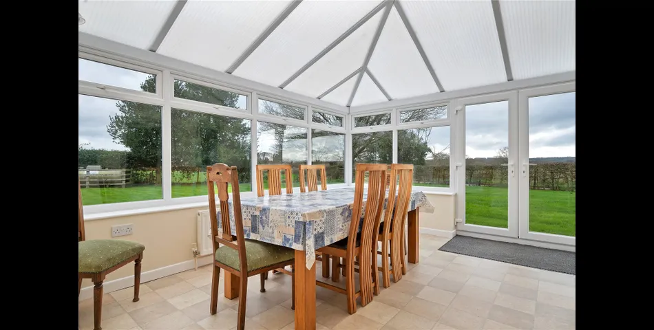 A two-bedroom semi-detached red brick cottage with generous gardens and parking