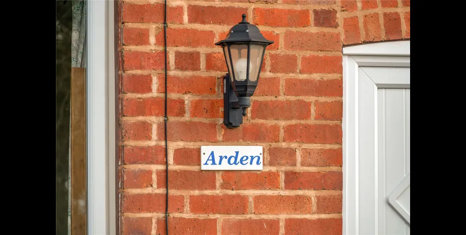 A two-bedroom semi-detached red brick cottage with generous gardens and parking