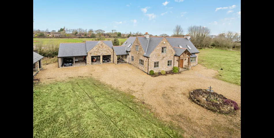 A generous family residence in c.3.68 acres of land within a village setting.