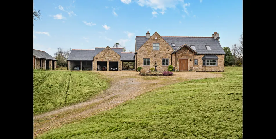 A generous family residence in c.3.68 acres of land within a village setting.