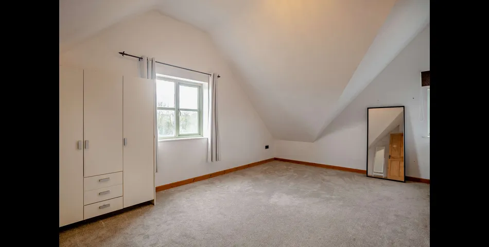 A generous family residence in c.3.68 acres of land within a village setting.