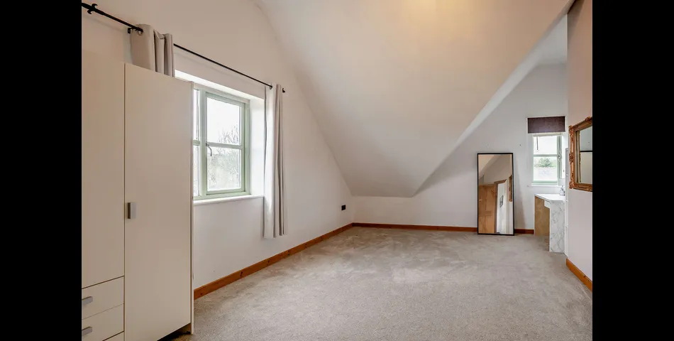 A generous family residence in c.3.68 acres of land within a village setting.