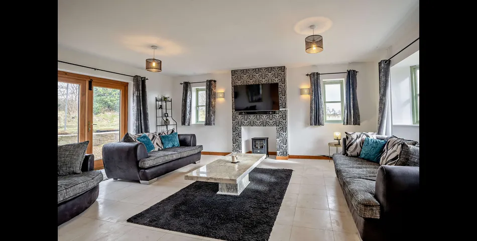 A generous family residence in c.3.68 acres of land within a village setting.