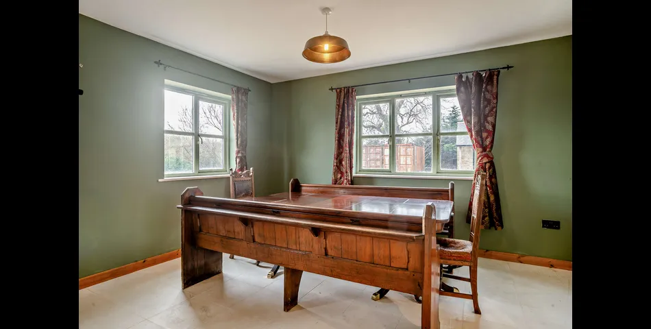 A generous family residence in c.3.68 acres of land within a village setting.