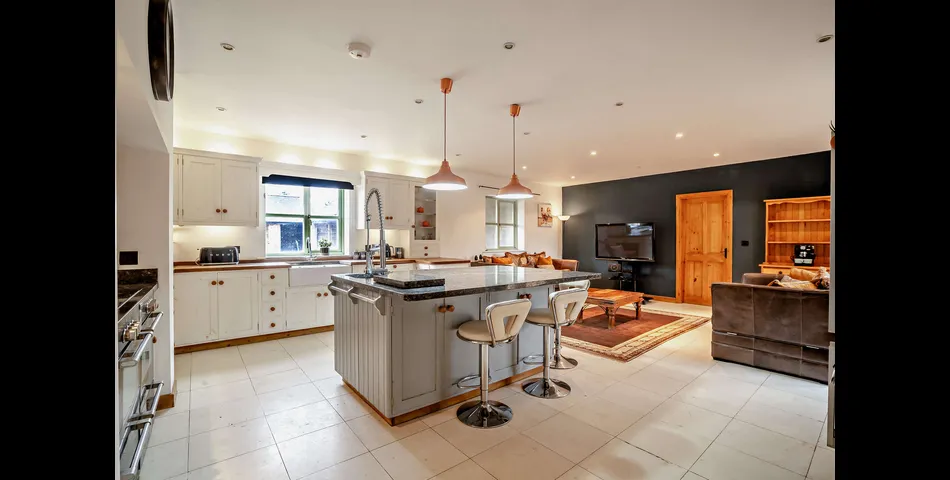 A generous family residence in c.3.68 acres of land within a village setting.