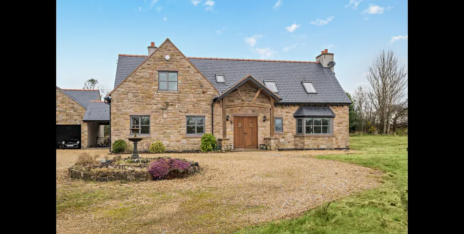 A generous family residence in c.3.68 acres of land within a village setting.