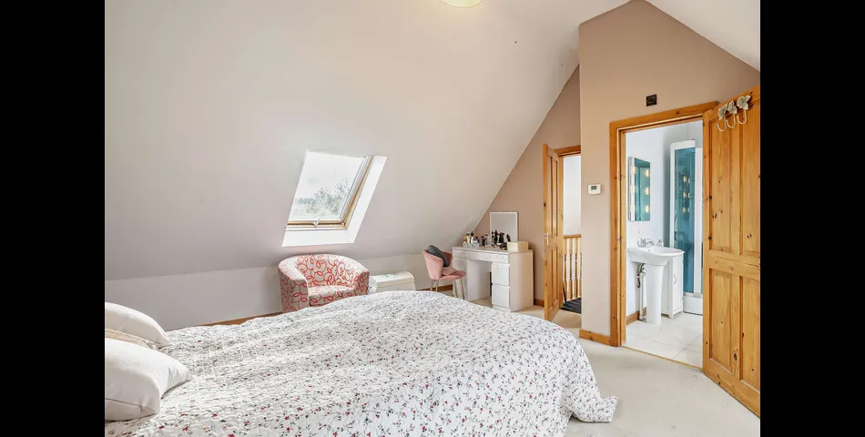 A generous family residence in c.3.68 acres of land within a village setting.