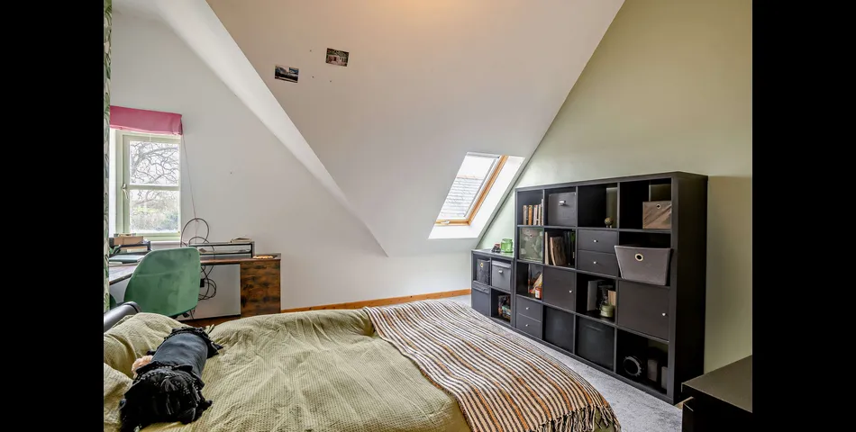 A generous family residence in c.3.68 acres of land within a village setting.