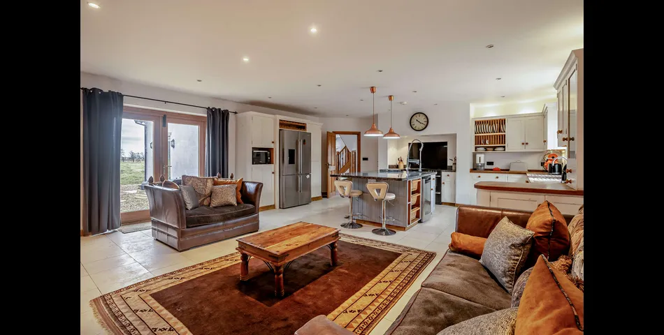 A generous family residence in c.3.68 acres of land within a village setting.