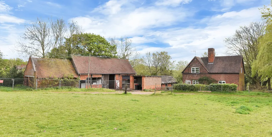 A smallholding with a cottage in need of total refurbishment, outbuildings and about 7.35 acres of land