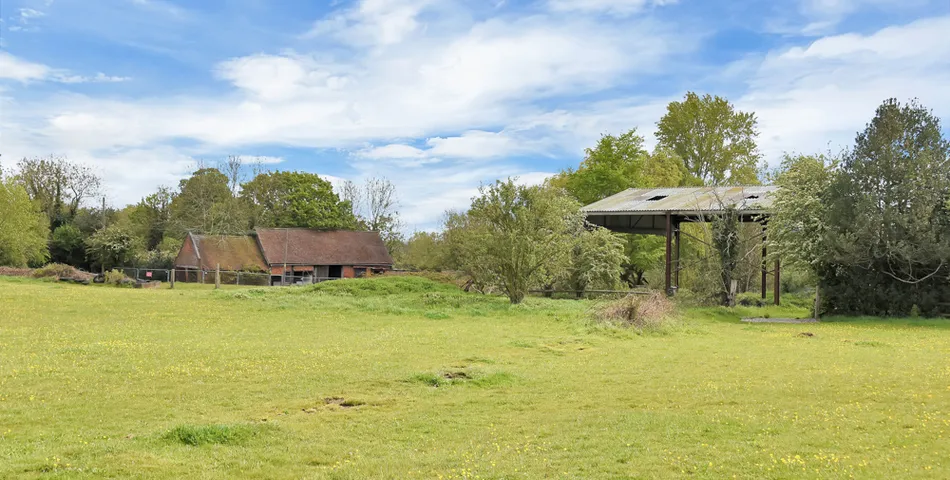 A smallholding with a cottage in need of total refurbishment, outbuildings and about 7.35 acres of land