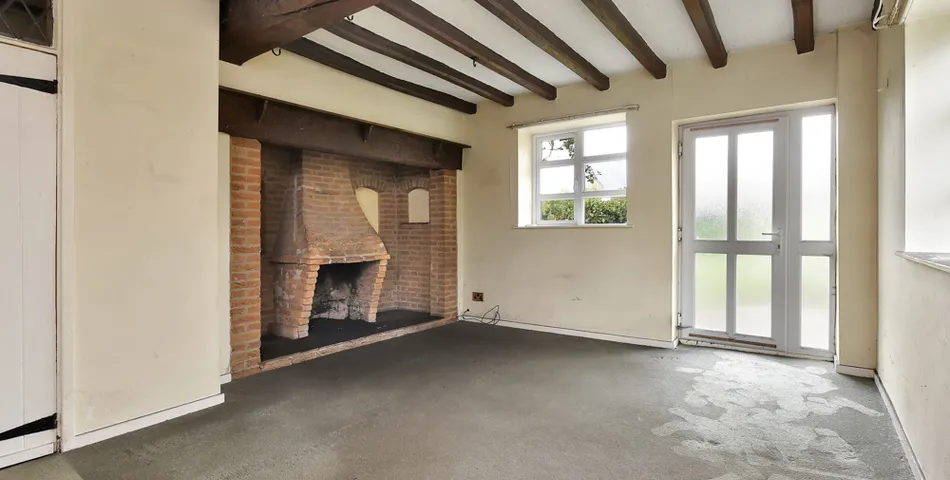 A smallholding with a cottage in need of total refurbishment, outbuildings and about 7.35 acres of land