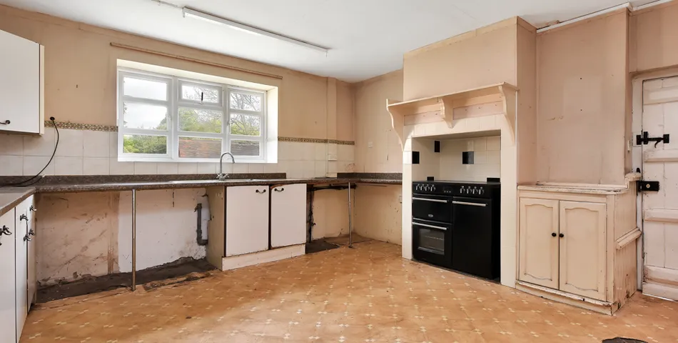 A smallholding with a cottage in need of total refurbishment, outbuildings and about 7.35 acres of land