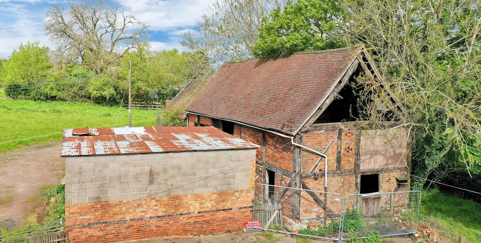 A smallholding with a cottage in need of total refurbishment, outbuildings and about 7.35 acres of land