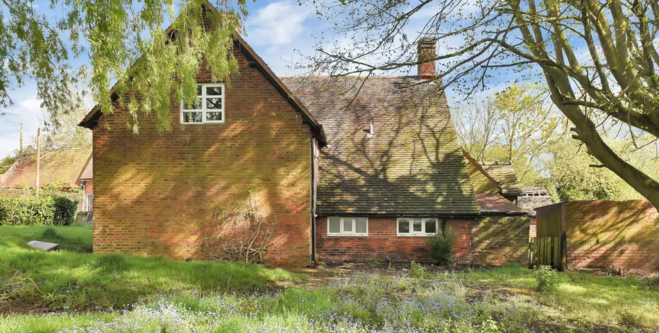 A smallholding with a cottage in need of total refurbishment, outbuildings and about 7.35 acres of land