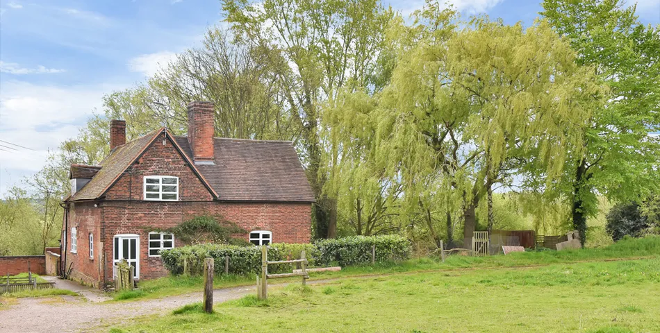 A smallholding with a cottage in need of total refurbishment, outbuildings and about 7.35 acres of land