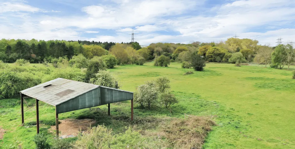A smallholding with a cottage in need of total refurbishment, outbuildings and about 7.35 acres of land