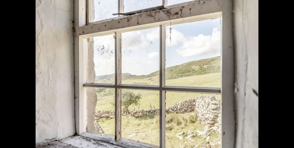 A traditional Welsh stone farmhouse requiring renovation, along with ancillary buildings, in an elevated setting with spectacular views towards Cardigan Bay and Snowdonia National Park, within 3.29 acres