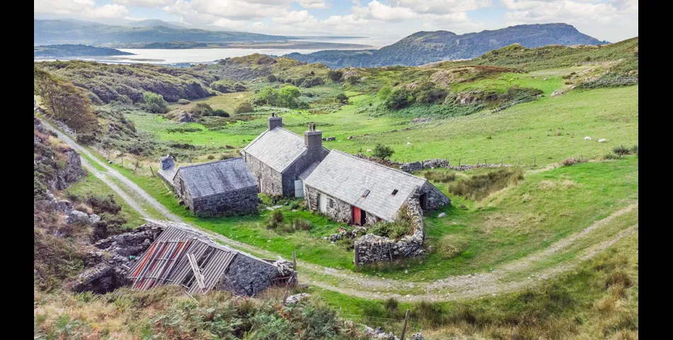 A traditional Welsh stone farmhouse requiring renovation, along with ancillary buildings, in an elevated setting with spectacular views towards Cardigan Bay and Snowdonia National Park, within 3.29 acres