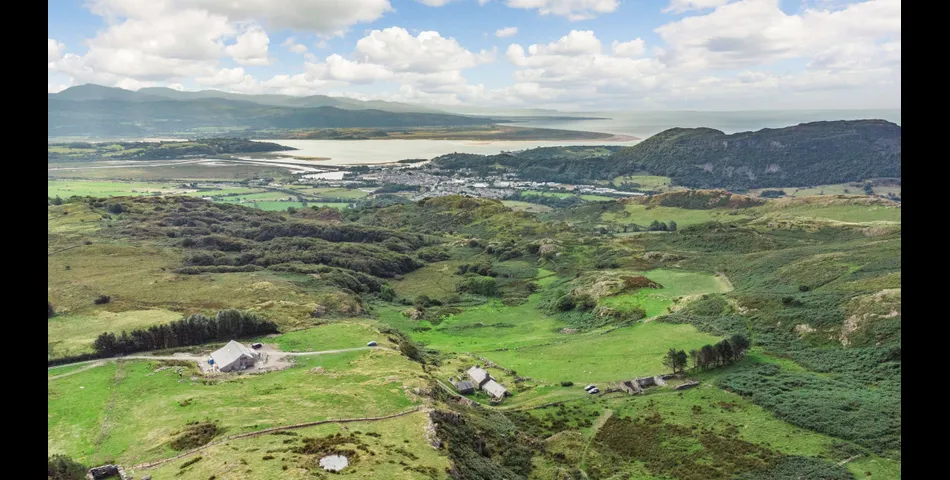 A traditional Welsh stone farmhouse requiring renovation, along with ancillary buildings, in an elevated setting with spectacular views towards Cardigan Bay and Snowdonia National Park, within 3.29 acres