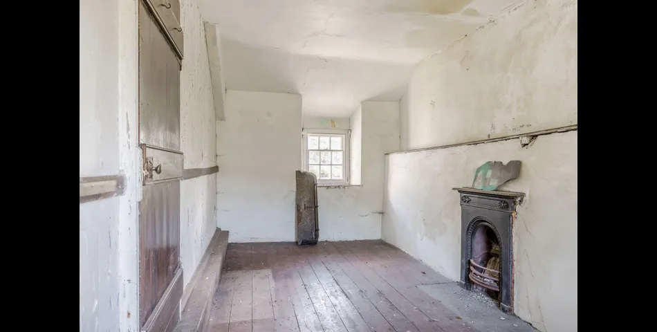 A traditional Welsh stone farmhouse requiring renovation, along with ancillary buildings, in an elevated setting with spectacular views towards Cardigan Bay and Snowdonia National Park, within 3.29 acres