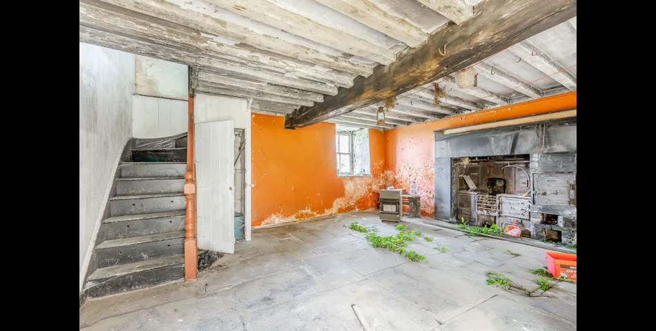A traditional Welsh stone farmhouse requiring renovation, along with ancillary buildings, in an elevated setting with spectacular views towards Cardigan Bay and Snowdonia National Park, within 3.29 acres