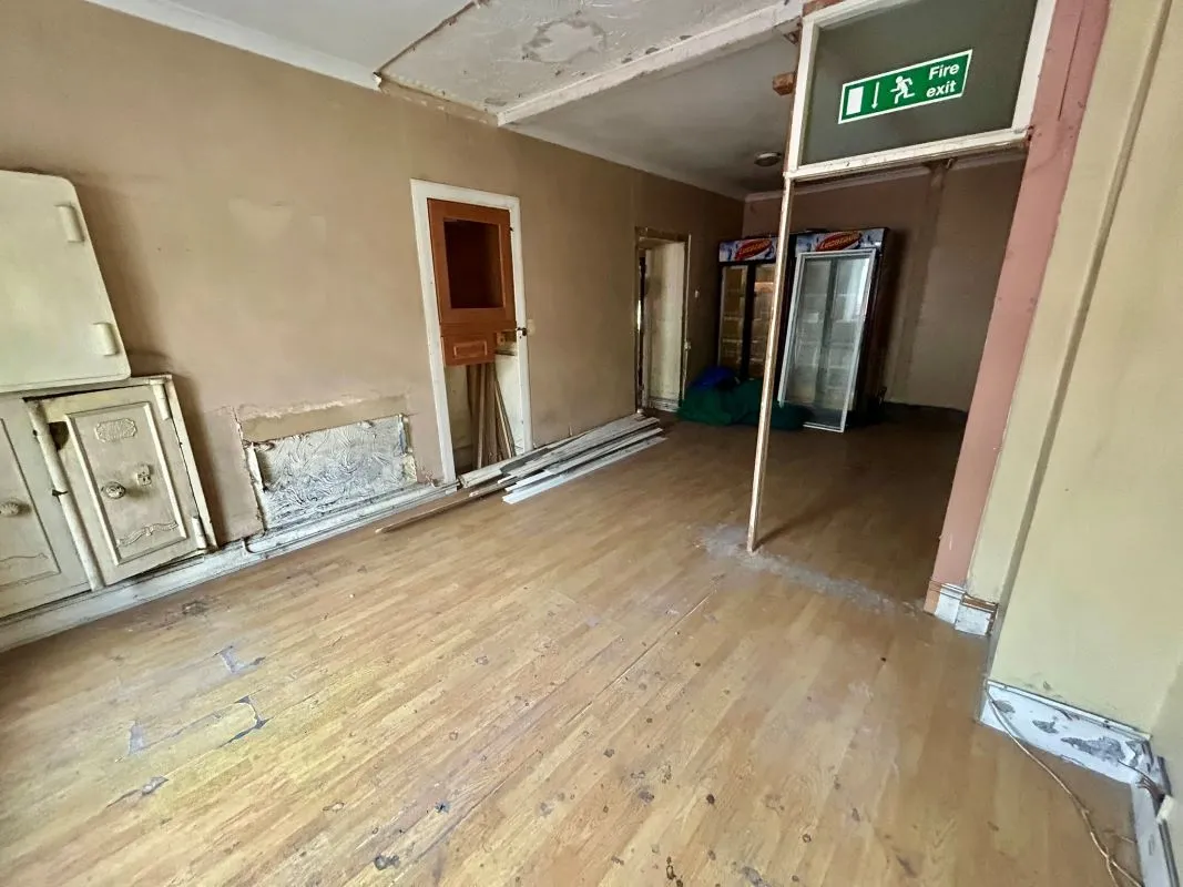 Opportunity to acquire this three storey end of terrace property in Neath. Three retail units to the ground floor with residential redevelopment opportunity to upper floors and a large rear car park.