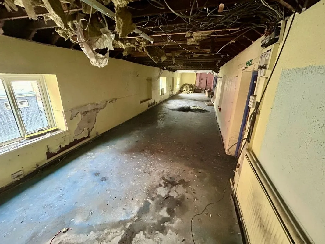 Opportunity to acquire this three storey end of terrace property in Neath. Three retail units to the ground floor with residential redevelopment opportunity to upper floors and a large rear car park.