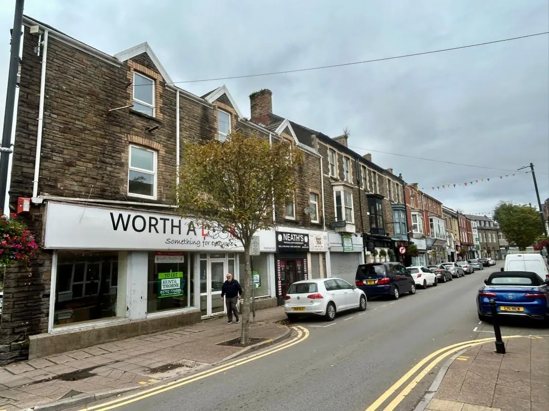 Opportunity to acquire this three storey end of terrace property in Neath. Three retail units to the ground floor with residential redevelopment opportunity to upper floors and a large rear car park.
