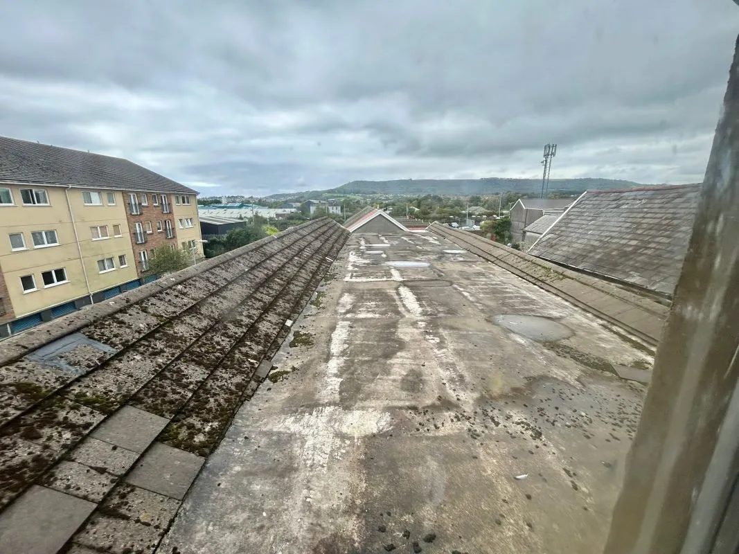 Opportunity to acquire this three storey end of terrace property in Neath. Three retail units to the ground floor with residential redevelopment opportunity to upper floors and a large rear car park.