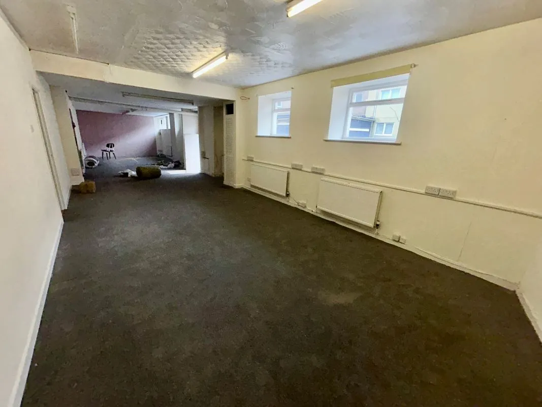 Opportunity to acquire this three storey end of terrace property in Neath. Three retail units to the ground floor with residential redevelopment opportunity to upper floors and a large rear car park.