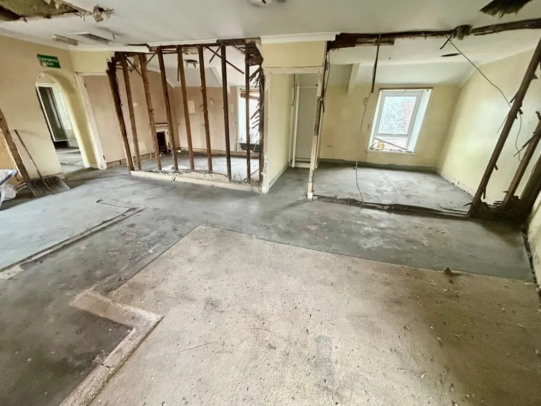 Opportunity to acquire this three storey end of terrace property in Neath. Three retail units to the ground floor with residential redevelopment opportunity to upper floors and a large rear car park.