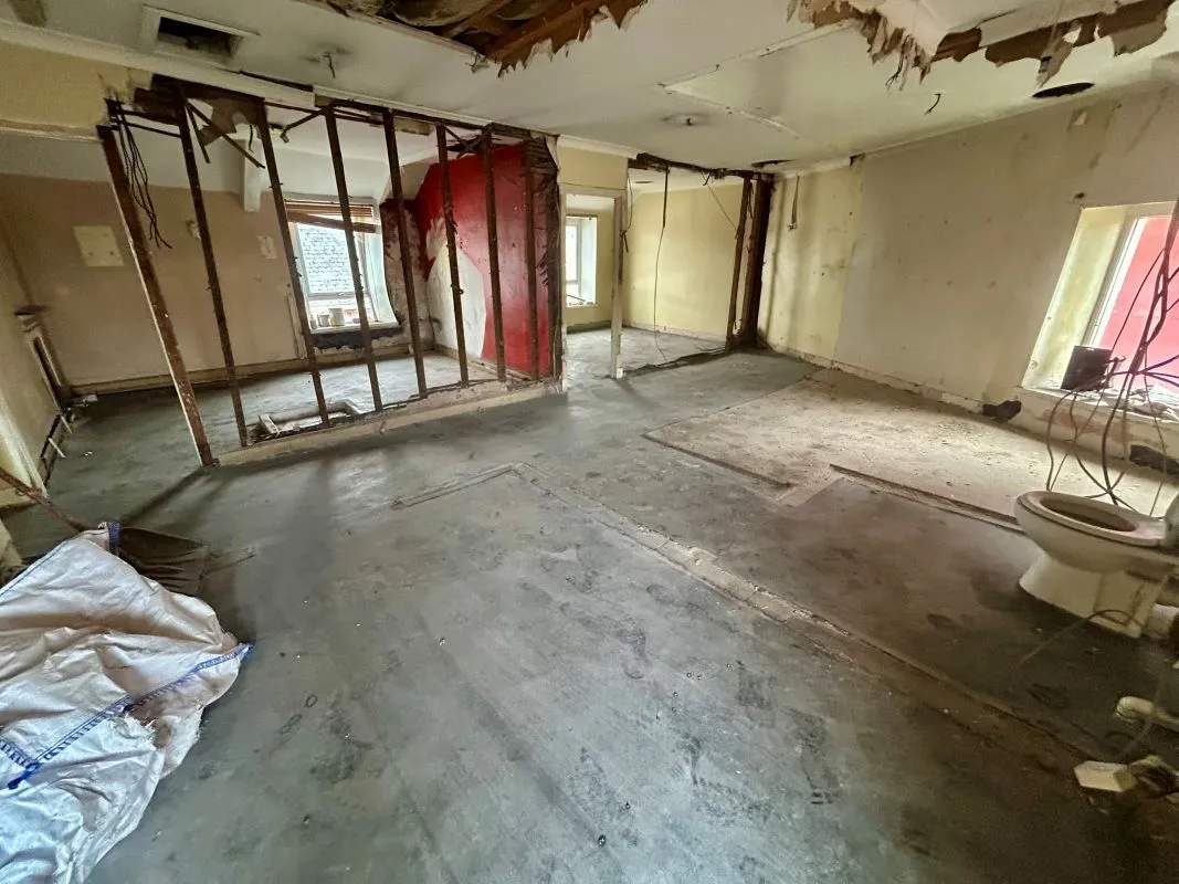 Opportunity to acquire this three storey end of terrace property in Neath. Three retail units to the ground floor with residential redevelopment opportunity to upper floors and a large rear car park.